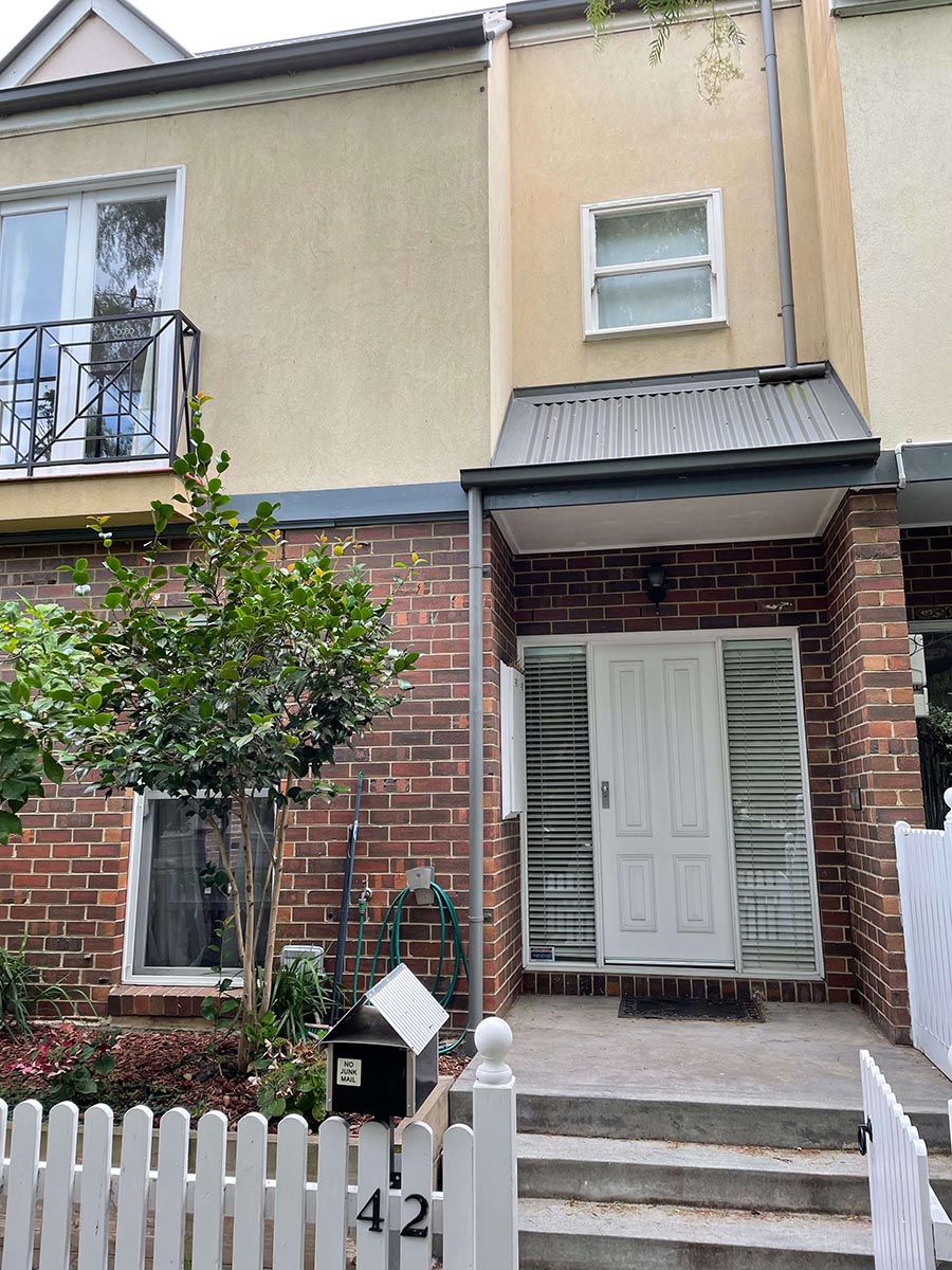 The front of a house in Kensington with white door